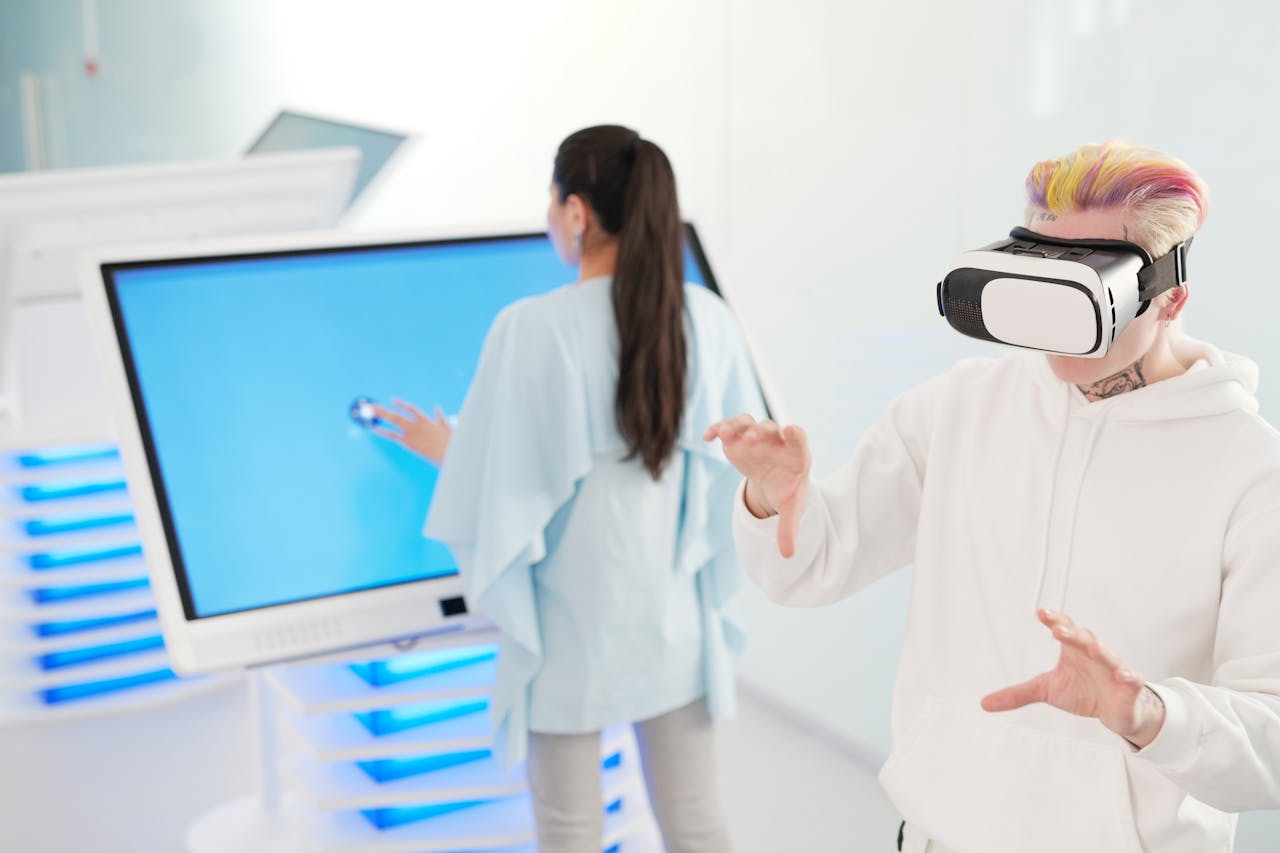 Two young adults engaging with VR and touchscreen technology in a futuristic room.